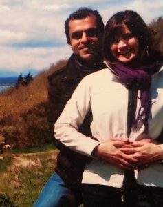Sohail Yousaf in a black jacket and blue jeans posing with his wife Neda in a white jacket and black pants.